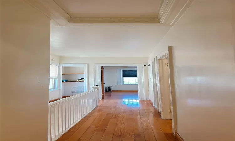 Hall featuring light wood finished floors