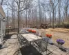 Back of house featuring a yard, a patio area, and a chimney