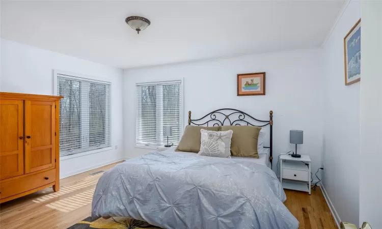 Bedroom with wood finished floors