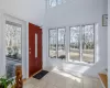 Living area featuring recessed lighting, light wood-type flooring, baseboards, and a notable chandelier