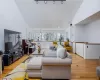 Living area featuring light wood-type flooring and baseboards