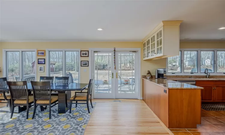 Dining space featuring visible vents, recessed lighting, french doors, and light wood-style floors