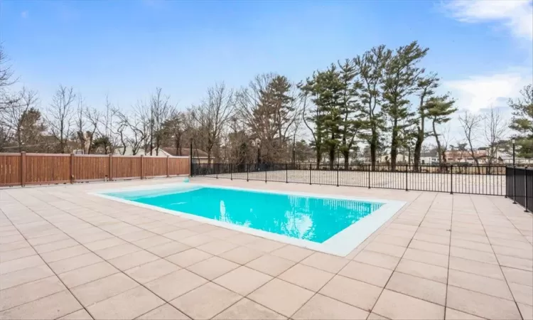 View of pool with and a patio area