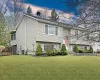 Split foyer home featuring a yard and central AC