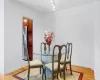 Dining room featuring light wood-type flooring and baseboards