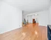 Unfurnished living room with baseboards and light wood-type flooring