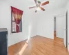 Empty room featuring a ceiling fan, light wood-style floors, and baseboards