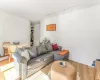 Living room featuring baseboards and rail lighting