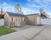 View of outbuilding with an outbuilding and fence