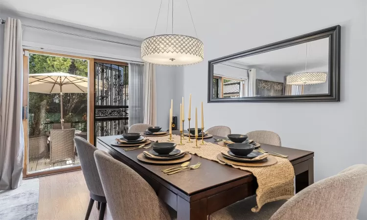 Dining area featuring wood finished floors and a healthy amount of sunlight