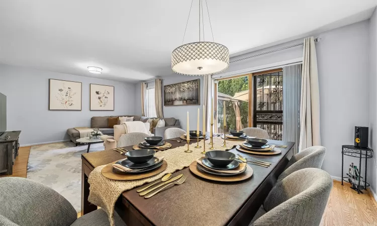 Dining space featuring baseboards and wood finished floors