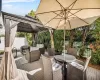 Deck featuring a gazebo, an outdoor hangout area, outdoor dining area, and fence