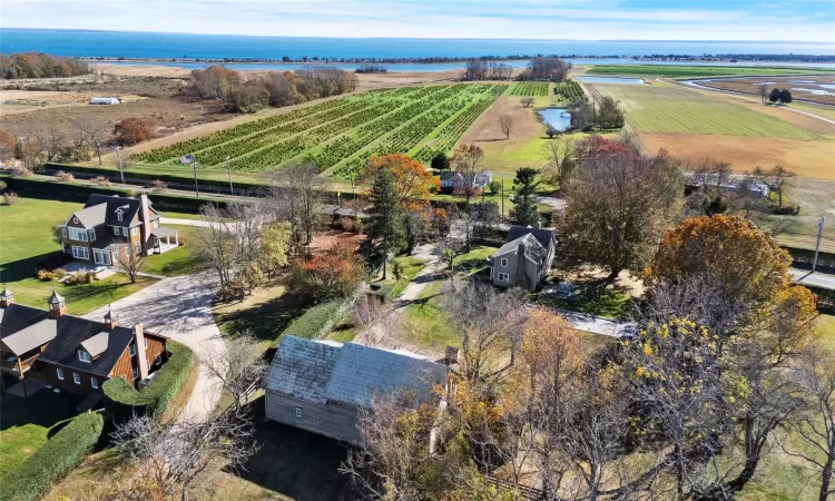 Birds eye view of property featuring a rural view and a water view