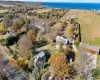 Bird's eye view with a water view and a rural view