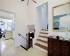 Stairway featuring an inviting chandelier, recessed lighting, and tile patterned floors