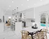 Dining area featuring a toaster, recessed lighting, and marble finish floor