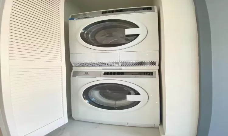 Clothes washing area with laundry area and stacked washer / drying machine