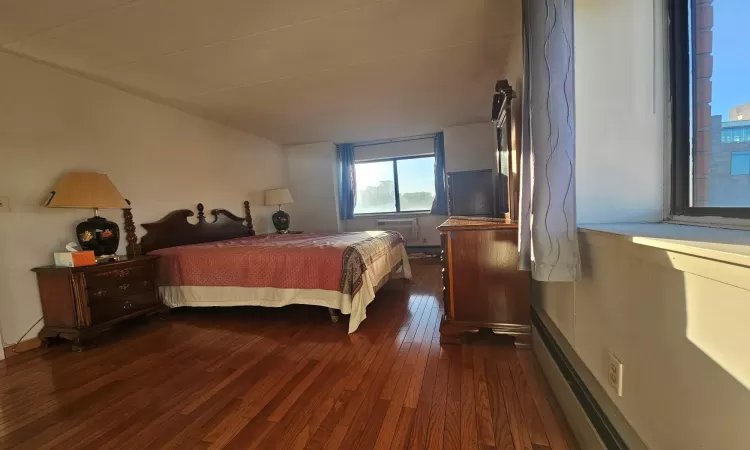 Bedroom featuring dark wood finished floors