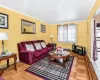 Living room featuring baseboards and ornamental molding