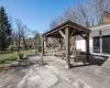 View of patio with a gazebo and outdoor dining area