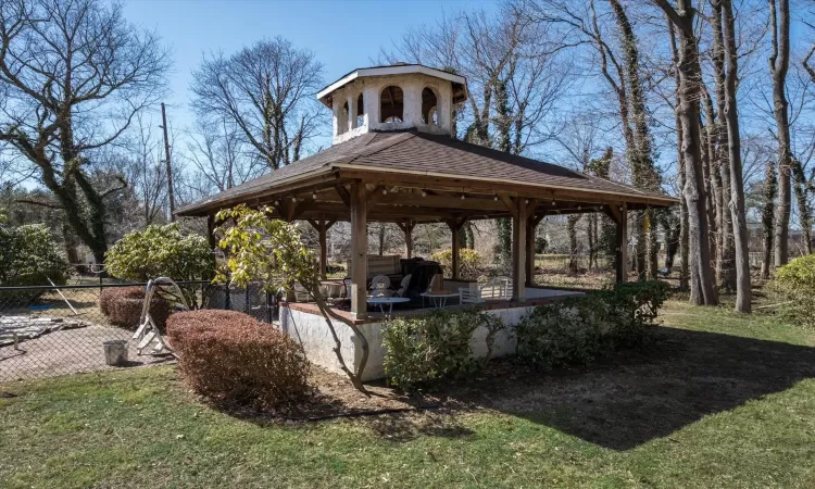 View of yard featuring a gazebo and fence