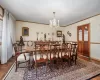 Dining space featuring crown molding and a chandelier