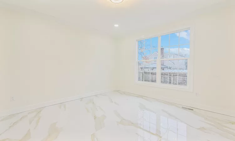 Unfurnished room featuring ornamental molding