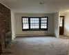 Living room, a fireplace, and brand new carpet flooring