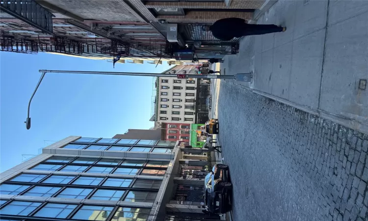 View of road with curbs, street lights, and sidewalks