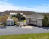 Birds eye view of property featuring a wooded view