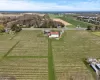 Birds eye view of property with a rural view