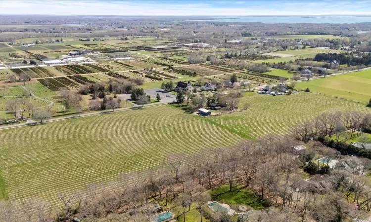 Birds eye view of property featuring a rural view