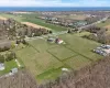 Birds eye view of property with a rural view