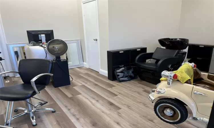 Office space featuring baseboards and wood finished floors