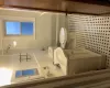 Bathroom with decorative backsplash, toilet, vanity, and shower / tub combination