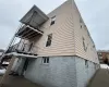 View of side of property featuring a balcony