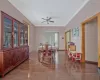 Dining area with ceiling fan, baseboards, wood finished floors, and ornamental molding