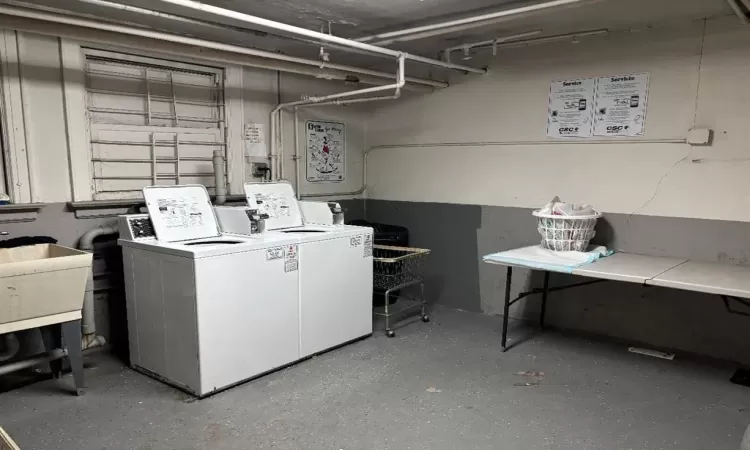 Clothes washing area with washer and clothes dryer and laundry area