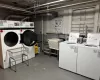 Laundry room with washer and dryer and a sink