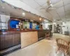 Reception with visible vents, a ceiling fan, and indoor bar