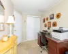 Office space featuring crown molding and light carpet