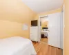 Bedroom featuring lofted ceiling and light wood finished floors