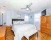 Bedroom with visible vents, a ceiling fan, and light wood finished floors