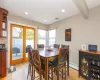 Dining room featuring visible vents, beam ceiling, recessed lighting, light wood-style floors, and a baseboard heating unit