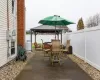 View of patio with a gazebo, a fenced backyard, and outdoor dining space