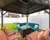 View of patio / terrace with a gazebo, a fenced backyard, and outdoor lounge area