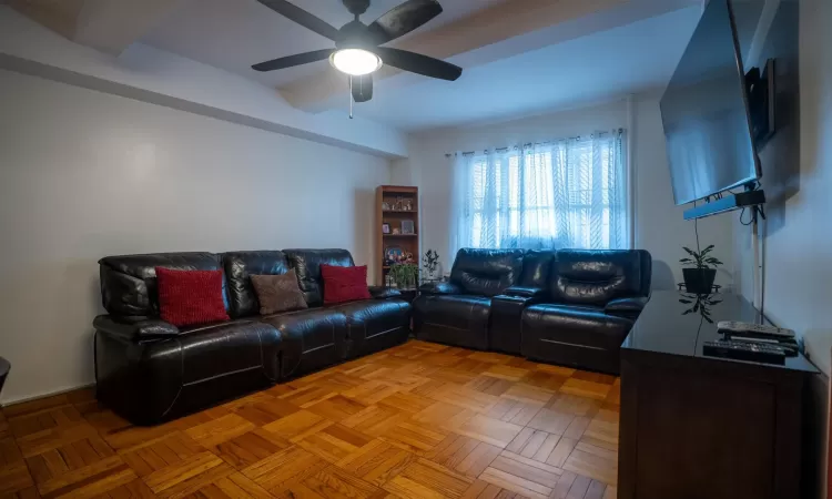 Living room featuring ceiling fan