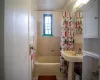 Bathroom featuring tile patterned flooring and shower / bath combo with shower curtain