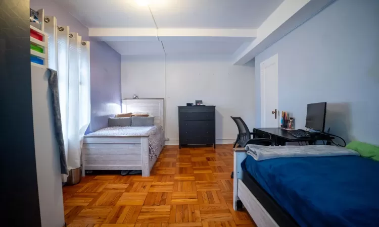 Bedroom with beam ceiling