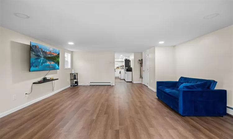 Living area featuring recessed lighting, and wood finished floors